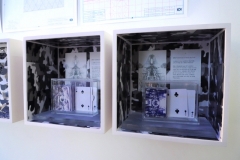 IOI Performance Box: Group Assembled Klondike Solitaire , mounted box with snow camo collages, xylene transfer drawings and objects